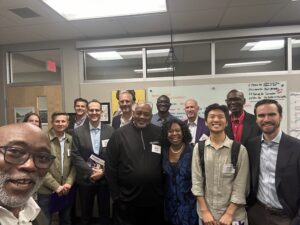 Group of men and women looking at camera